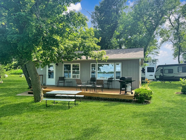 50 Shady Rest Rd, Lake Sarah Twp, MN 56132 - back of property featuring a yard, a wooden deck, and a shingled roof