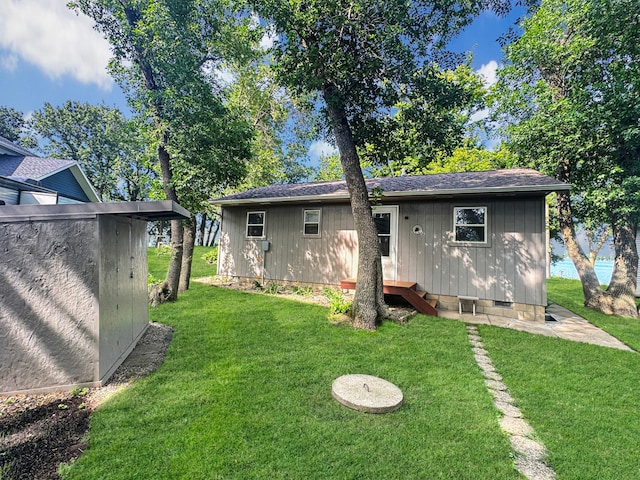 50 Shady Rest Rd, Lake Sarah Twp, MN 56132 - back of house featuring roof with shingles and a yard