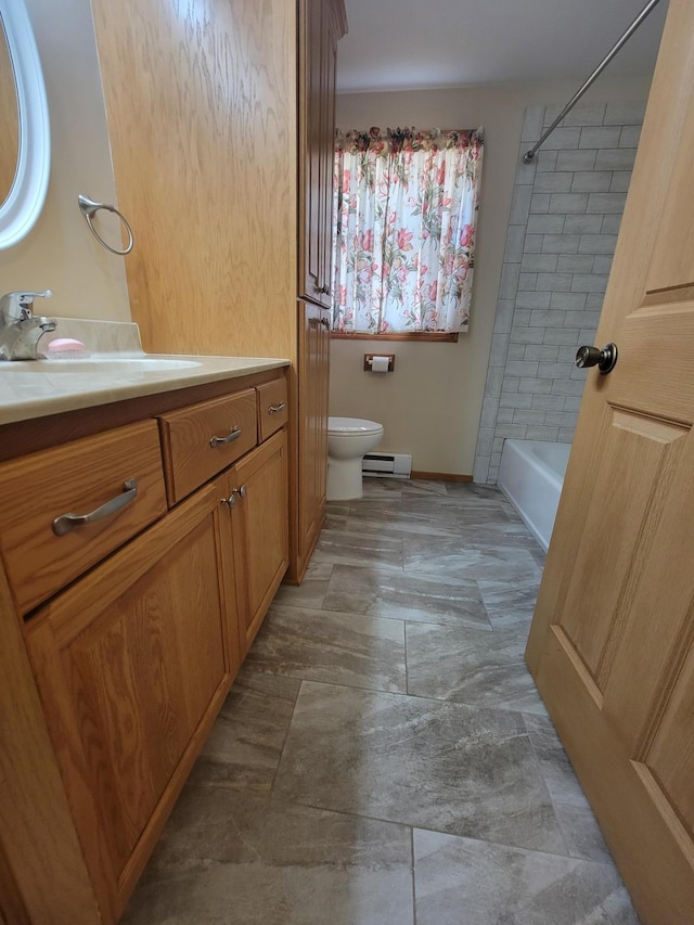619 3rd St NW, Forest Lake, MN 55025 - full bathroom featuring vanity, tub / shower combination, and baseboard heating