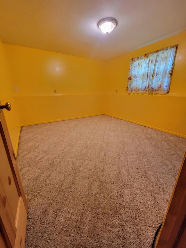 619 3rd St NW, Forest Lake, MN 55025 - spare room featuring carpet floors and baseboards