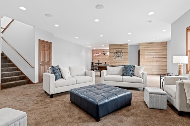 12605 314th St, Lindstrom, MN 55045 - carpeted living area featuring recessed lighting, stairway, and wooden walls