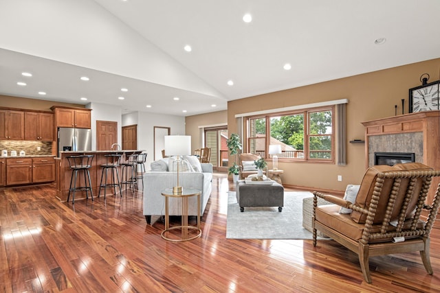 12605 314th St, Lindstrom, MN 55045 - living area featuring hardwood / wood-style flooring, a premium fireplace, recessed lighting, and high vaulted ceiling