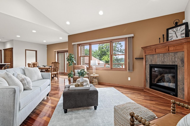 12605 314th St, Lindstrom, MN 55045 - living area featuring lofted ceiling, recessed lighting, wood finished floors, and a high end fireplace