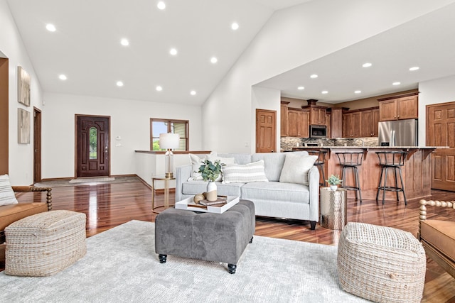 12605 314th St, Lindstrom, MN 55045 - living room with wood finished floors, high vaulted ceiling, and recessed lighting