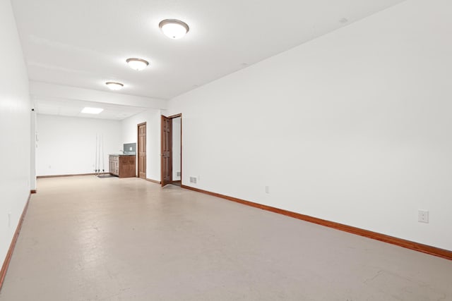 12605 314th St, Lindstrom, MN 55045 - empty room with finished concrete floors and baseboards