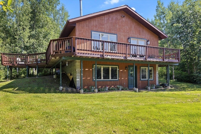 1063 Fernberg Rd, Fall Lake Twp, MN 55731 - back of house featuring a deck and a lawn