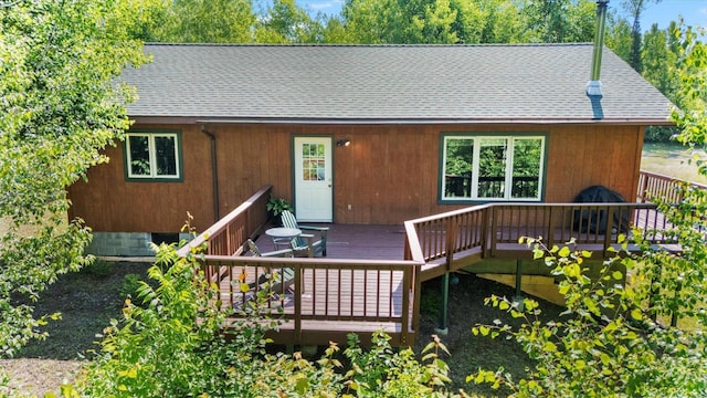 1063 Fernberg Rd, Fall Lake Twp, MN 55731 - chalet / cabin featuring a deck and roof with shingles