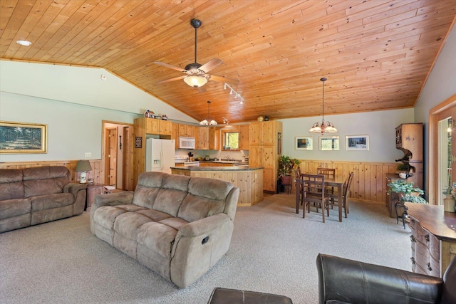 1063 Fernberg Rd, Fall Lake Twp, MN 55731 - living room with a chandelier, lofted ceiling, light carpet, wood ceiling, and wainscoting