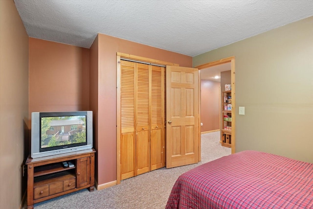 1063 Fernberg Rd, Fall Lake Twp, MN 55731 - carpeted bedroom with a closet and a textured ceiling