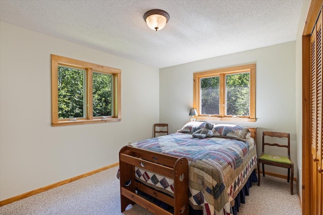 1063 Fernberg Rd, Fall Lake Twp, MN 55731 - bedroom featuring light carpet and a textured ceiling
