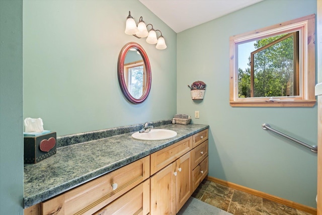 1063 Fernberg Rd, Fall Lake Twp, MN 55731 - bathroom with vanity and stone finish floors