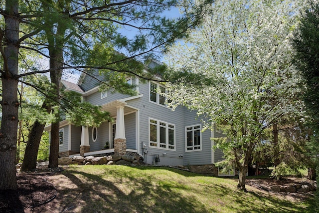 17244 Valley Rd, Eden Prairie, MN 55347 - view of side of home with a porch and a yard