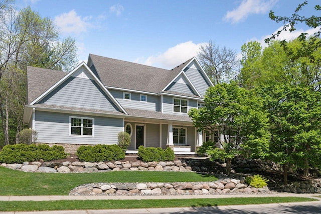 17244 Valley Rd, Eden Prairie, MN 55347 - view of front of home featuring roof with shingles, a porch, and a front yard