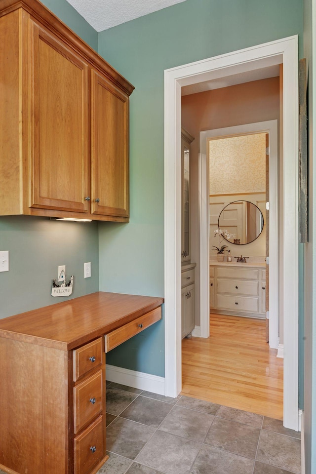 17244 Valley Rd, Eden Prairie, MN 55347 - office area with built in study area and light tile patterned floors