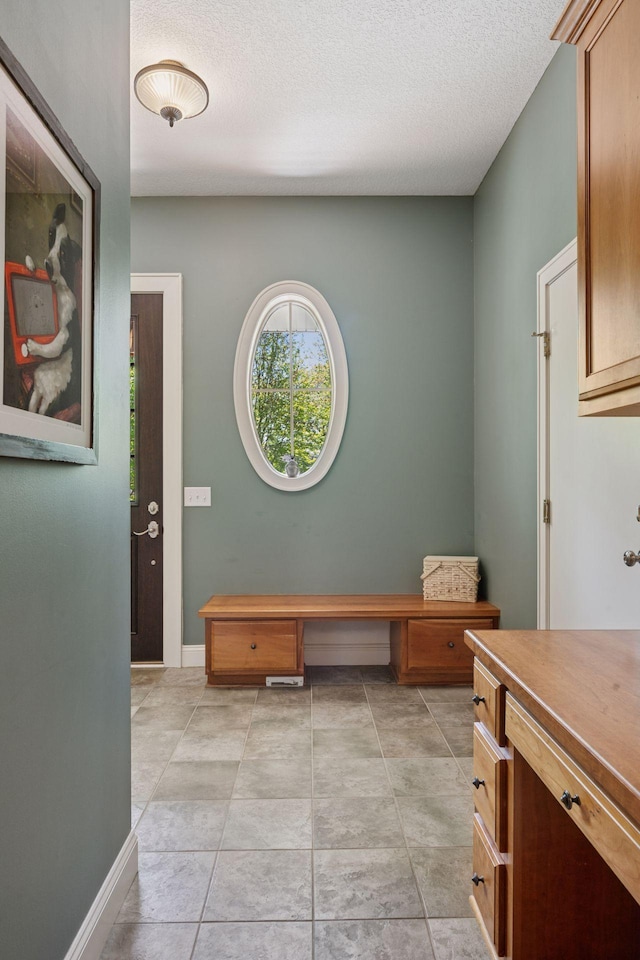 17244 Valley Rd, Eden Prairie, MN 55347 - entryway featuring a textured ceiling and light tile patterned floors