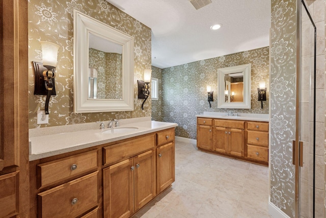 17244 Valley Rd, Eden Prairie, MN 55347 - bathroom with two vanities, wallpapered walls, and tile patterned floors