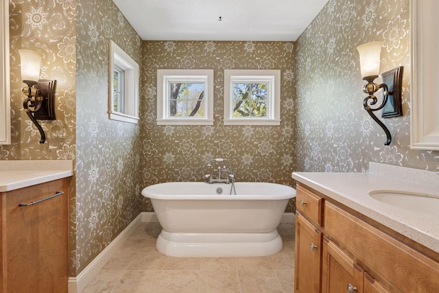17244 Valley Rd, Eden Prairie, MN 55347 - full bathroom featuring vanity, wallpapered walls, healthy amount of natural light, a soaking tub, and tile patterned floors