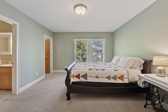 17244 Valley Rd, Eden Prairie, MN 55347 - bedroom with light carpet, ensuite bathroom, and a textured ceiling