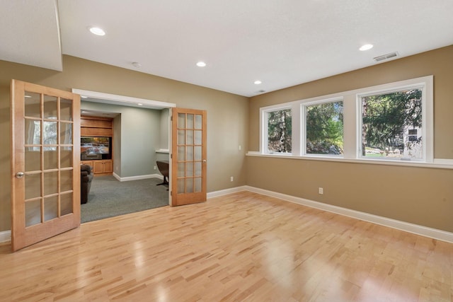 17244 Valley Rd, Eden Prairie, MN 55347 - unfurnished room featuring french doors, wood finished floors, and recessed lighting