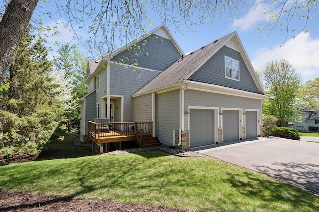 17244 Valley Rd, Eden Prairie, MN 55347 - view of side of home with asphalt driveway, a deck, a garage, a yard, and roof with shingles