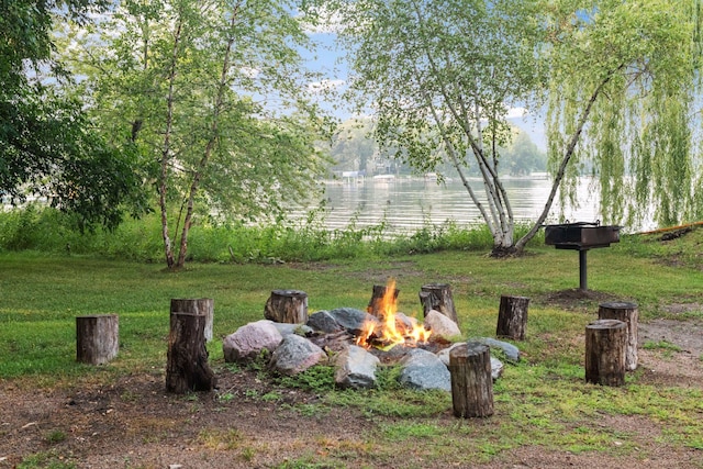17244 Valley Rd, Eden Prairie, MN 55347 - view of green lawn with a fire pit and a water view