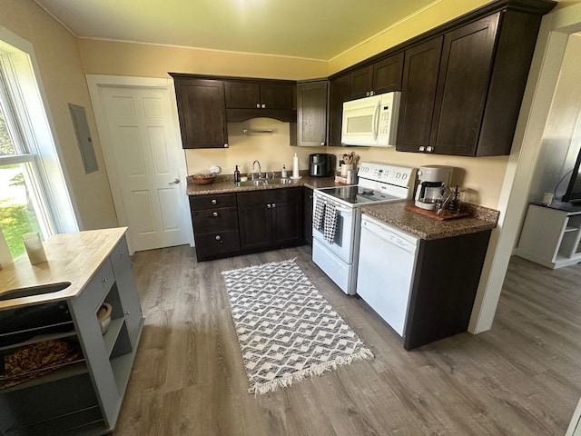 502 1st Ave SW, Baudette, MN 56623 - kitchen featuring white appliances, wood finished floors, dark brown cabinetry, electric panel, and open shelves