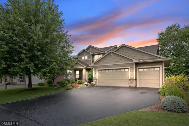 3631 Woodcrest Cir, Eagan, MN 55123 - craftsman inspired home featuring stone siding, driveway, and an attached garage