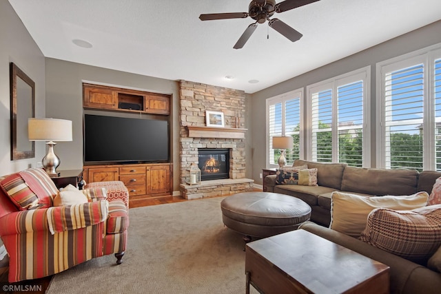 3631 Woodcrest Cir, Eagan, MN 55123 - living area featuring a ceiling fan, carpet flooring, and a stone fireplace