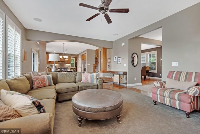 3631 Woodcrest Cir, Eagan, MN 55123 - living area featuring decorative columns, a ceiling fan, arched walkways, a chandelier, and recessed lighting