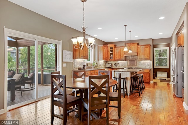3631 Woodcrest Cir, Eagan, MN 55123 - dining area with light wood-type flooring, healthy amount of natural light, a chandelier, and recessed lighting