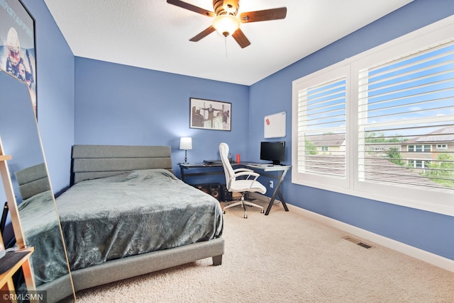 3631 Woodcrest Cir, Eagan, MN 55123 - carpeted bedroom featuring a ceiling fan and a desk