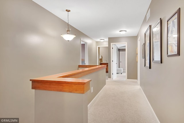 3631 Woodcrest Cir, Eagan, MN 55123 - corridor featuring baseboards and light colored carpet