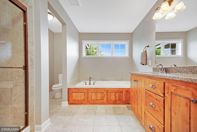3631 Woodcrest Cir, Eagan, MN 55123 - full bathroom featuring vanity, a shower stall, a garden tub, and tile patterned floors