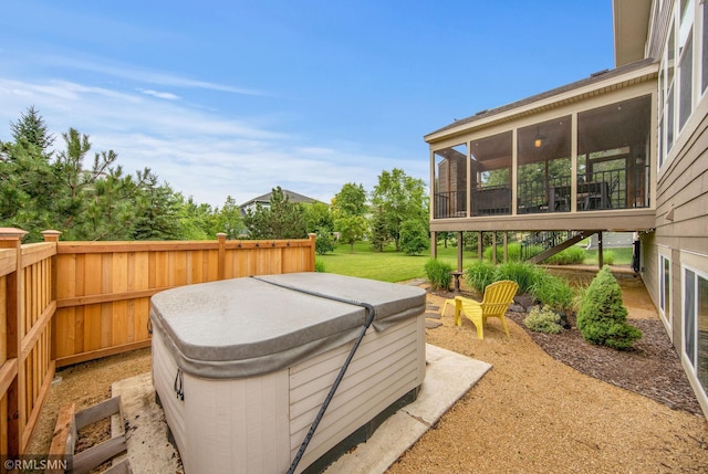 3631 Woodcrest Cir, Eagan, MN 55123 - view of patio with a hot tub and a sunroom