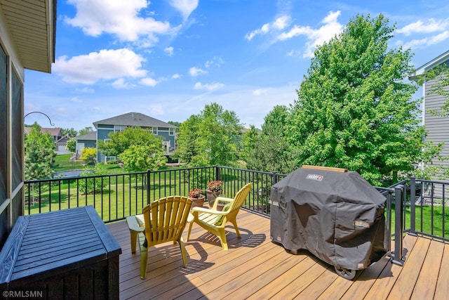 3631 Woodcrest Cir, Eagan, MN 55123 - wooden deck with a grill and a yard