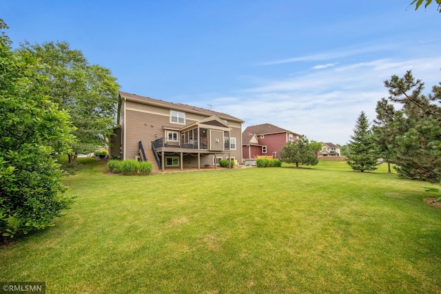 3631 Woodcrest Cir, Eagan, MN 55123 - rear view of property featuring a yard and a sunroom