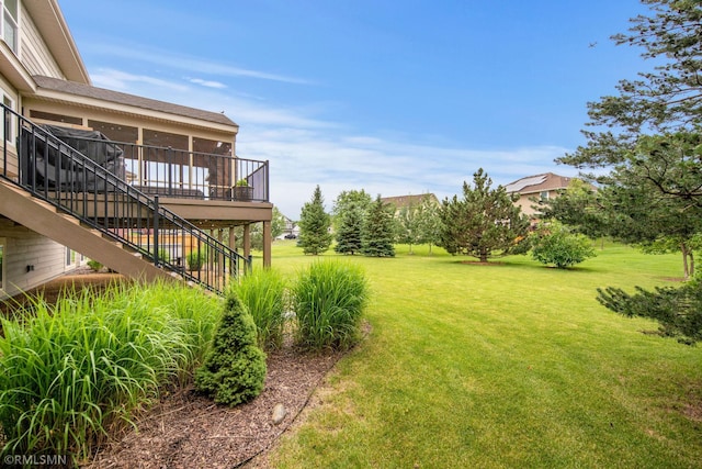 3631 Woodcrest Cir, Eagan, MN 55123 - view of green lawn with stairway and a deck