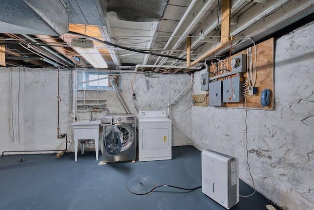3026 5th Ave E, Hibbing, MN 55746 - below grade area featuring separate washer and dryer and electric panel