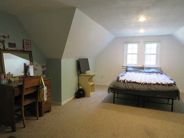 703 1st St SW, Wadena, MN 56482 - carpeted bedroom with lofted ceiling and baseboards