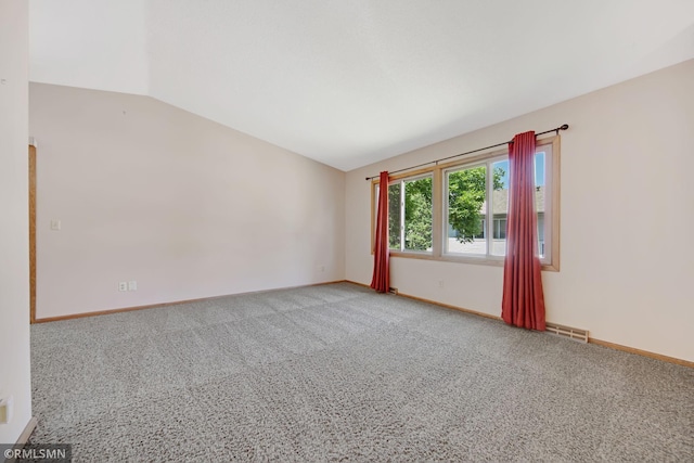 911 Lawnview Ave, Shoreview, MN 55126 - spare room featuring vaulted ceiling and carpet