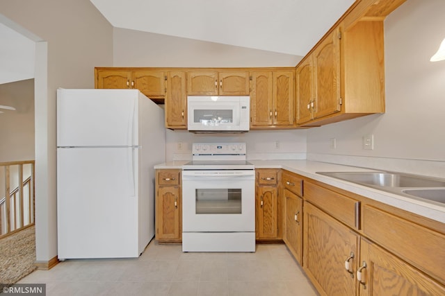 911 Lawnview Ave, Shoreview, MN 55126 - kitchen featuring white appliances, vaulted ceiling, light countertops, light tile patterned floors, and brown cabinetry