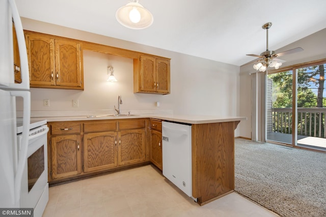 911 Lawnview Ave, Shoreview, MN 55126 - kitchen with a peninsula, white appliances, brown cabinetry, and vaulted ceiling