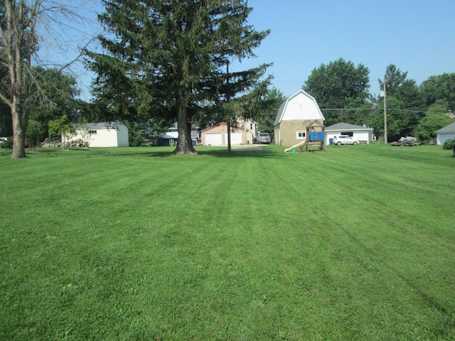 526 Red Wing Ave, Kenyon, MN 55946 - view of green lawn with an outdoor structure
