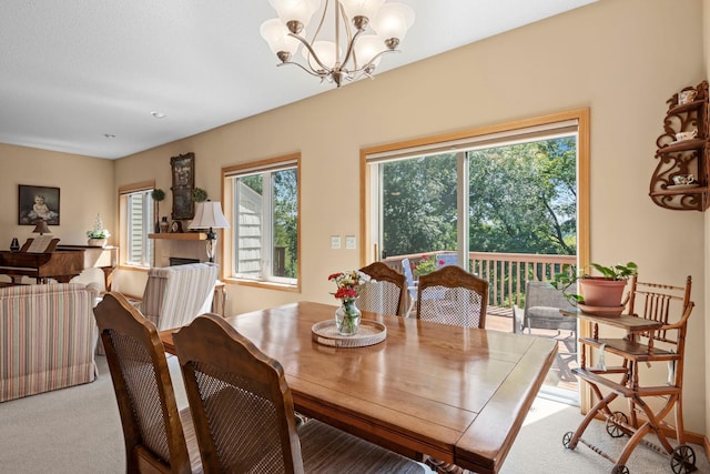 10931 185th Cir NW, Elk River, MN 55330 - carpeted dining room with a chandelier and baseboards