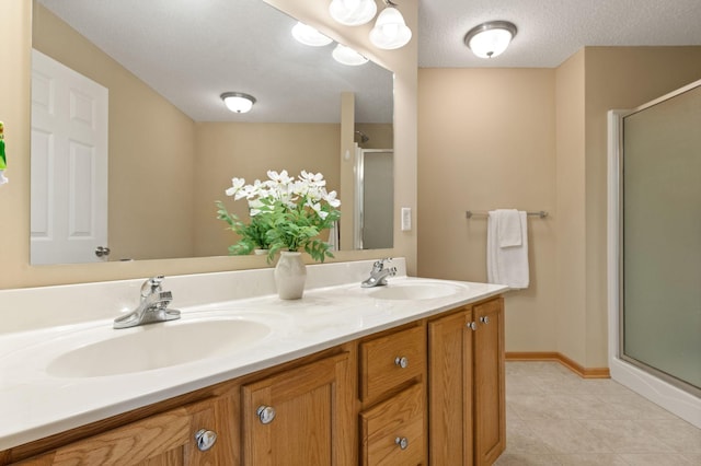 10931 185th Cir NW, Elk River, MN 55330 - bathroom featuring a shower stall, double vanity, and tile patterned flooring
