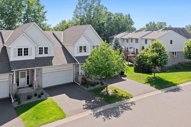 10931 185th Cir NW, Elk River, MN 55330 - traditional home with driveway, a front lawn, brick siding, and a shingled roof