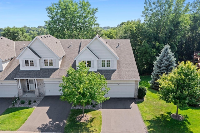 10931 185th Cir NW, Elk River, MN 55330 - traditional home with roof with shingles, asphalt driveway, a front lawn, and an attached garage