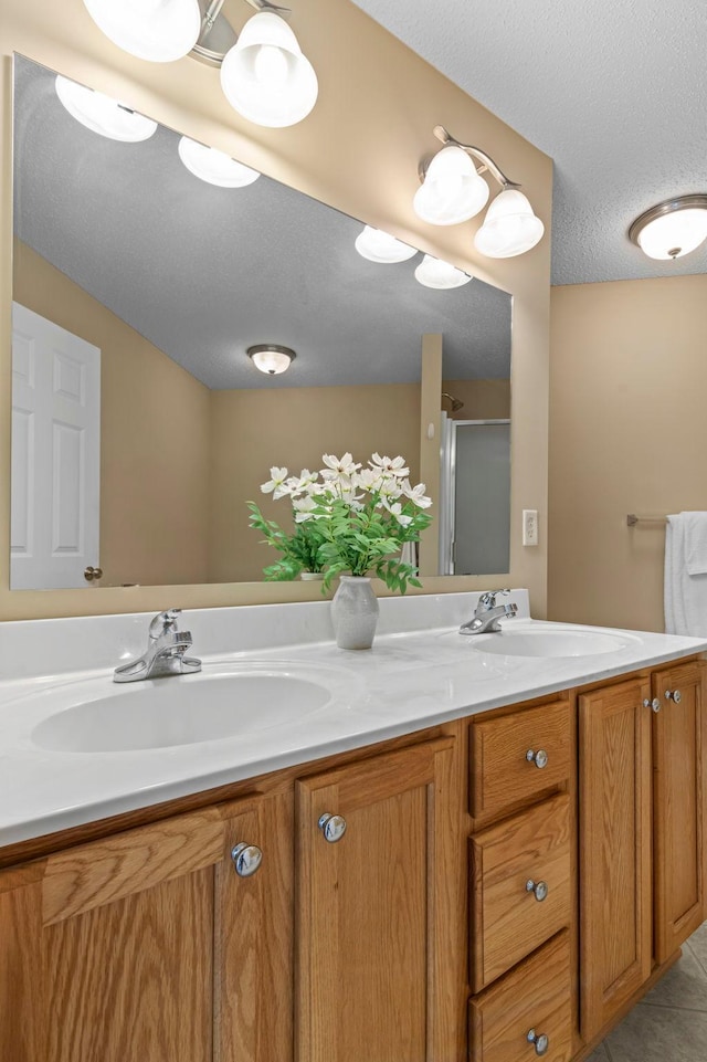10931 185th Cir NW, Elk River, MN 55330 - full bath with double vanity, a textured ceiling, and tile patterned floors