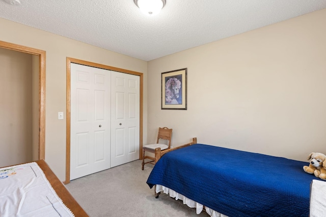 10931 185th Cir NW, Elk River, MN 55330 - carpeted bedroom featuring a closet and a textured ceiling