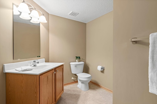 10931 185th Cir NW, Elk River, MN 55330 - bathroom with vanity, tile patterned floors, and a textured ceiling